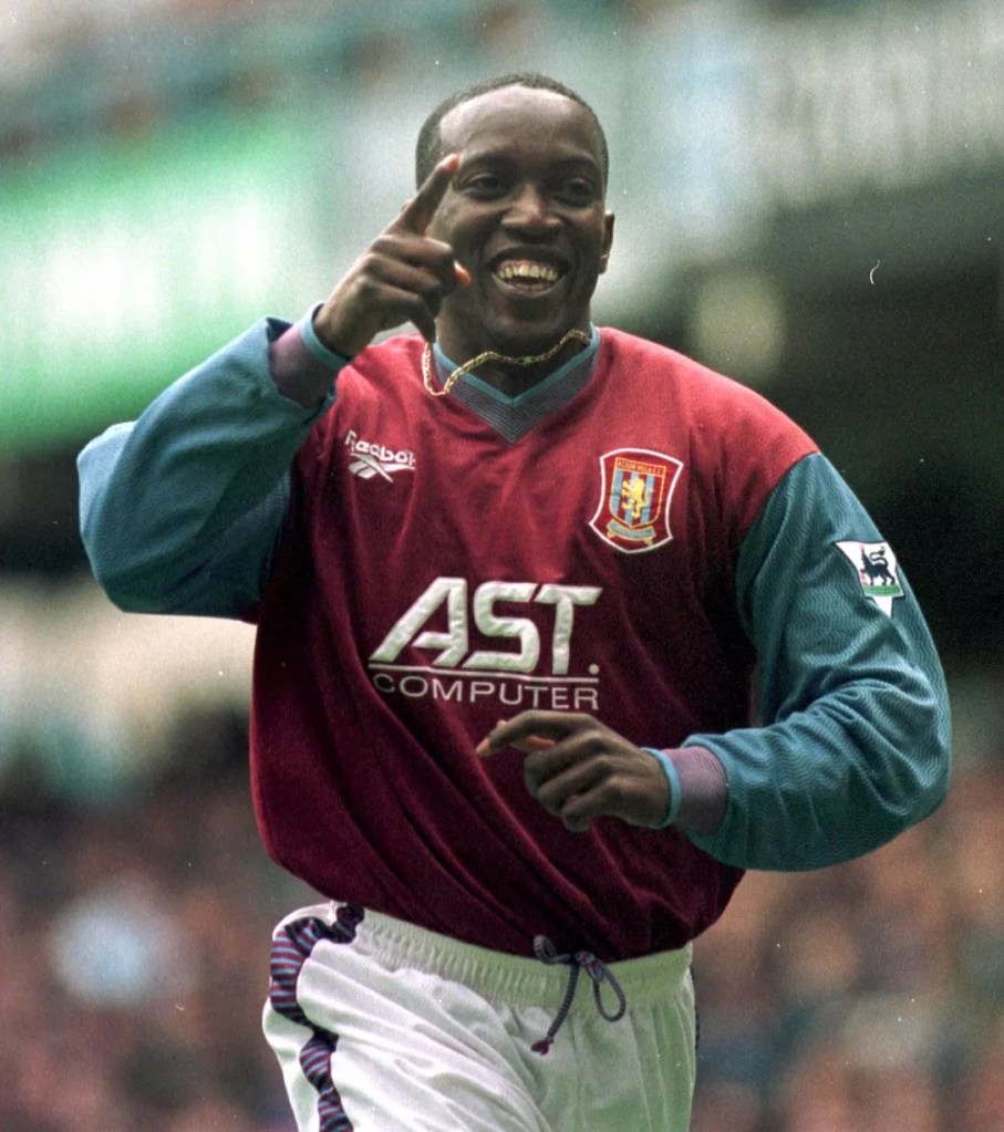 Football player smiling and running