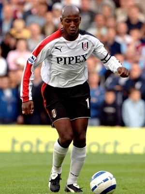 Football player kicking a ball.