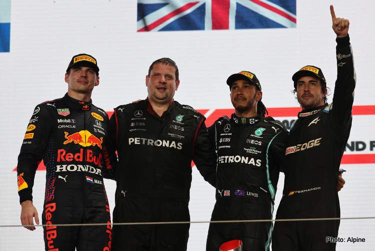 Winners standing on a podium in formula one world championship qatar grand prix