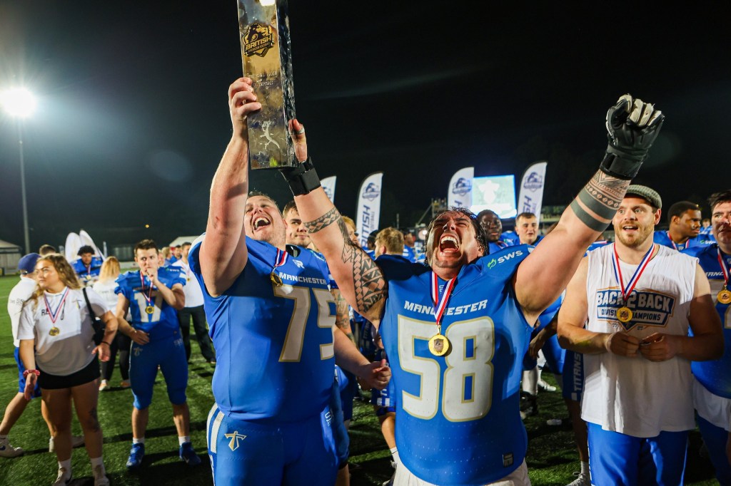 Manchester Titans lifting the trophy in the air